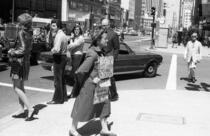 Woman with religious signs on Market Street at New Montgomery