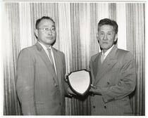 Kaoru Okamura and Sam Sakai with award