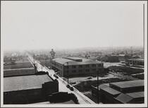 Looking south-southwest from roof of central manufacturing district (Vernon); residential town of Maywood in distance