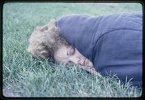 Woman sleeping on ground