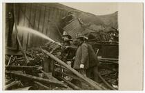 Fire fighters of Engine Co. No. 9 fighting fire, building exterior, Los Angeles