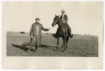 Men amind a field of cattle, circa 1924  