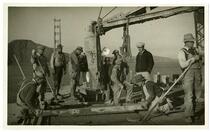 Golden Gate Bridge construction, men laying concrete