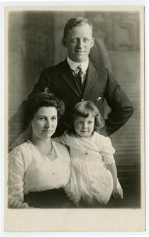 Portrait of fire captain R.E. Dunn with wife and young daughter, Los Angeles