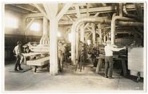 R-55 [Workers cutting sheets of wood]