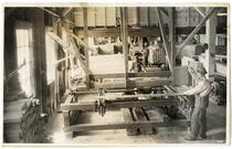 Men at work inside mill, California