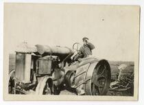 Agricultural worker operating machinery in the cotton fields, Tulare County, 1915
