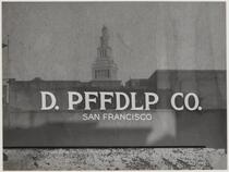 Ferry Building reflected in sign of D. PFFDLP Co., Drumm Street, San Francisco