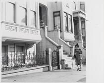 Woman walks down street, San Francisco