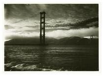 View of Golden Gate Bridge construction with fog