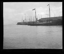 Steamer Lakme (right) and troopship docked in San Francisco Bay