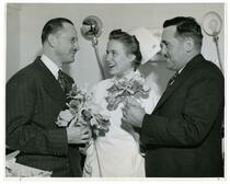 Norwell Agee and S.G. Armanino presenting flowers to Blood Bank nurse, Mrs. Ford Shepard, R.N.