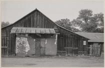 Adobe wall with barn built around it, Hornitos, Mariposa County, California