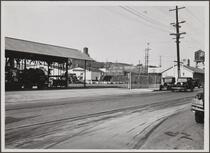 Looking northwest from Mateo and Willow Streets.; Union Oil Co. barrels