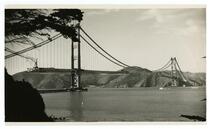 Golden Gate Bridge construction, view from east of Fort Point during raising of roadway