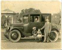 Portrait of family with automobile