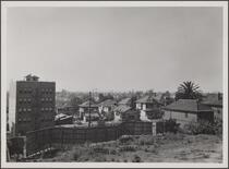 Looking south from 7th Street; parking place between Francisco and Bixel Streets, apartment house in foreground